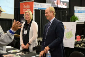 Lonnie Lawson, President and CEO of The Center for Rural Development and Laura Glover, Managing Director of Operations for The Center, at The Center’s booth during the SOAR Summit.